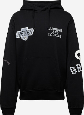 Grimey Sweatshirt 'CAUSING PANIC' in Black: front