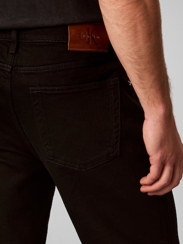 Calvin Klein Jeans Tapered Jeans in Schwarz