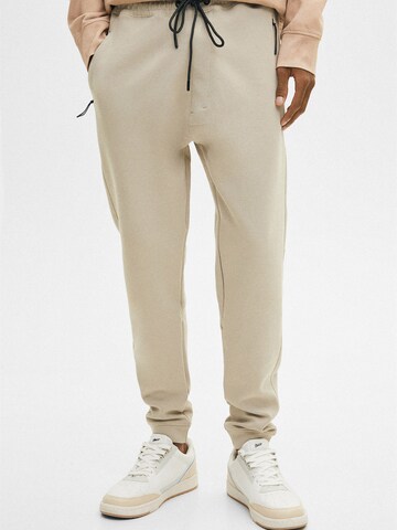 Pull&Bear Normalny krój Spodnie w kolorze beżowy