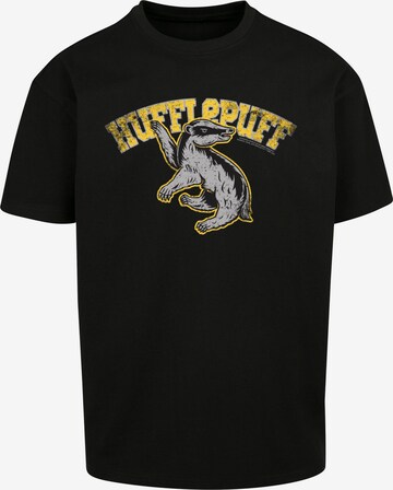 F4NT4STIC Shirt 'Harry Potter Hufflepuff Sport Emblem' in Zwart: voorkant