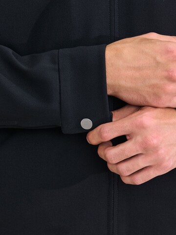 Next - Chaqueta de entretiempo 'Motionflex' en negro