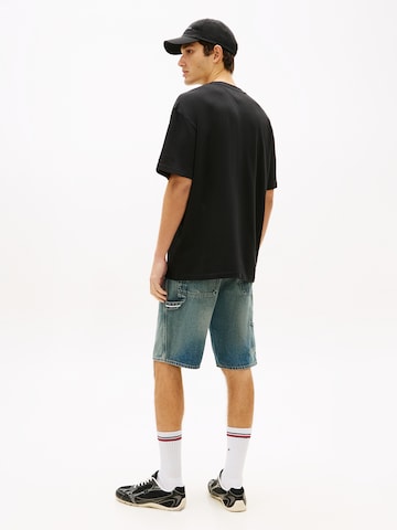 Tommy Jeans T-shirt 'BEAR' i svart