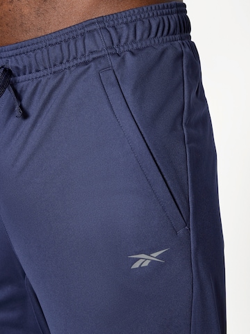 Reebok Štandardný strih Športové nohavice - Modrá