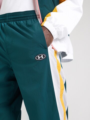 UNDER ARMOUR - Tapered Pantalón deportivo en verde