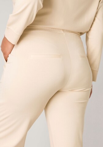 BASE LEVEL CURVY Regular Pleat-Front Pants in Beige