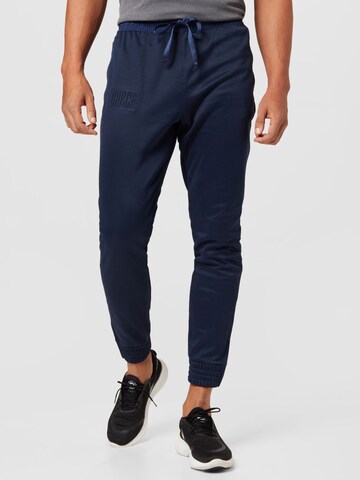 NIKE Tapered Sports trousers in Blue: front