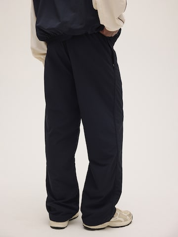 FILA - Loosefit Pantalón 'COLLALBO relaxed woven track pant' en azul
