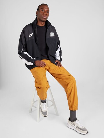 Tapered Pantaloni di Nike Sportswear in marrone