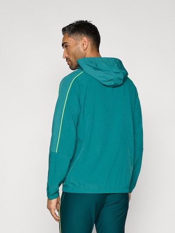 UNDER ARMOUR Αθλητικό μπουφάν 'Challenger' σε πράσινο