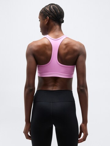 NIKE Bustier Biustonosz sportowy 'SWSH' w kolorze różowy