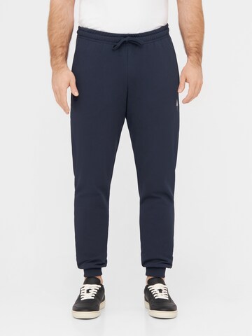 NIKIN Tapered Trousers 'Tree' in Blue: front