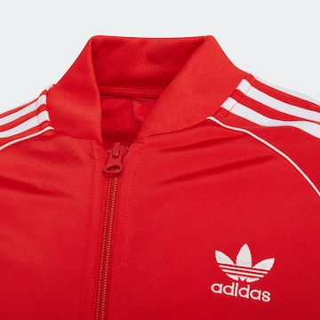 ADIDAS ORIGINALS Regular Between-Season Jacket 'Adicolor Sst' in Red