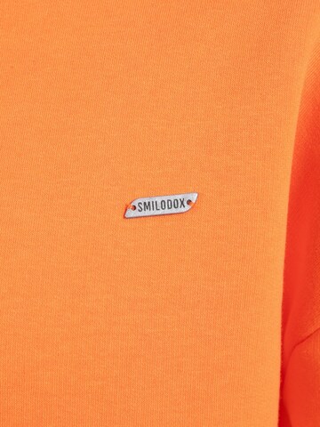 Veste de survêtement Smilodox en orange