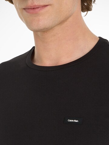 Calvin Klein Bluser & t-shirts i sort