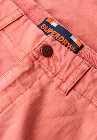 Superdry & Co Regular Chino trousers 'Vintage International' in Pink