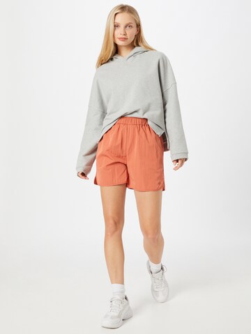 JUST FEMALE Normální Kalhoty 'Wish' – oranžová