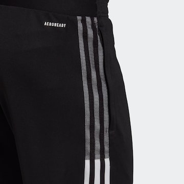 ADIDAS SPORTSWEAR Zwężany krój Spodnie sportowe 'Tiro 21' w kolorze czarny