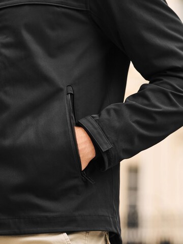 Veste fonctionnelle Next en noir