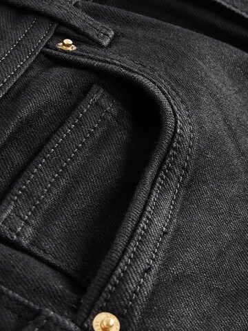 Skinny Jeans di Next in nero
