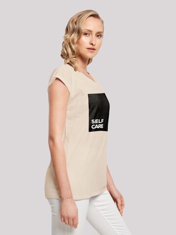 T-shirt 'SELF CARE' F4NT4STIC en beige