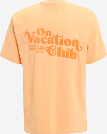 On Vacation Club T-Shirt 'Enjoy' in Orange