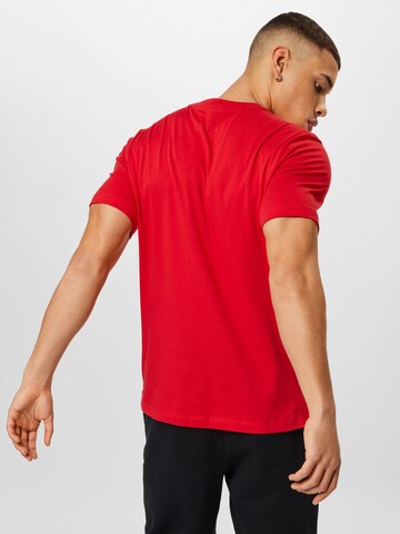 T-Shirt 'Swoosh' Nike Sportswear en rouge