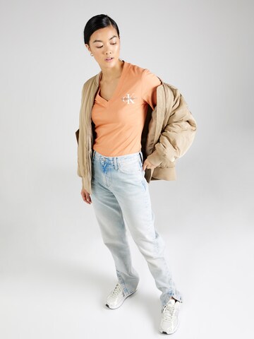 Calvin Klein Jeans Koszulka w kolorze pomarańczowy