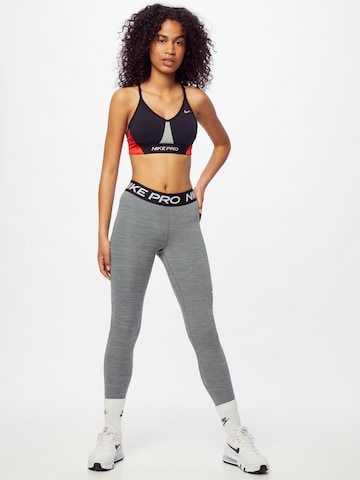 NIKE Skinny Sportbroek in Grijs