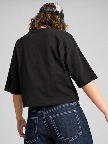 PUMA - Camiseta 'Puma Wardrobe Ess Oversized Short Tee Bl' en negro