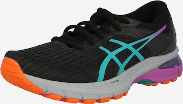 Chaussure de course ASICS en noir : devant