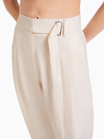 Bershka Loose fit Pleat-front trousers in Beige