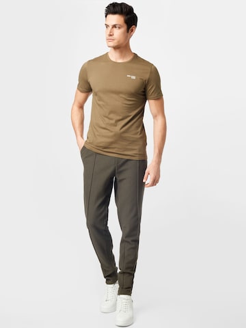 BURTON MENSWEAR LONDON Tapered Pants in Green