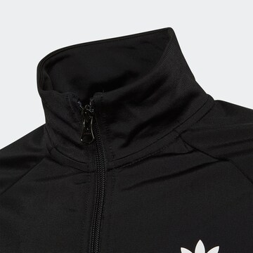 ADIDAS ORIGINALS Välikausitakki 'Track Top' värissä musta