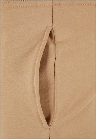 Tapered Pantaloni di Urban Classics in beige