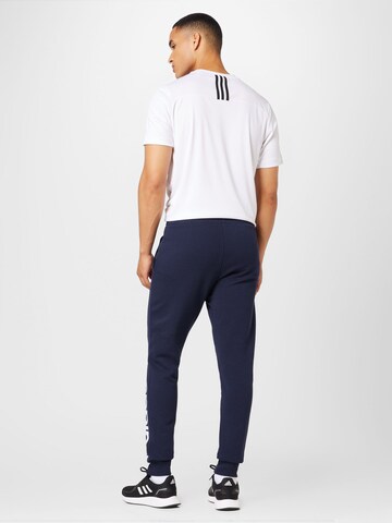 ADIDAS SPORTSWEAR Дънки Tapered Leg Спортен панталон 'Essentials French Terry Tapered Cuff Logo' в синьо
