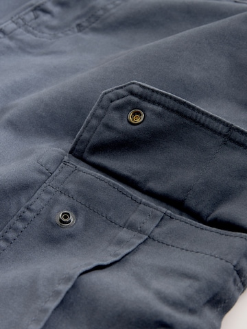 Next Slimfit Gargohousut värissä sininen