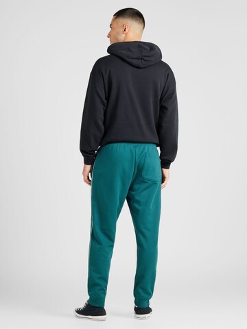 Tapered Pantaloni de la CONVERSE pe verde