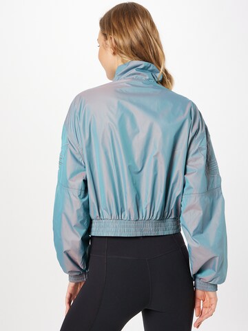 ADIDAS ORIGINALS - Chaqueta de entretiempo 'Iridescent' en azul