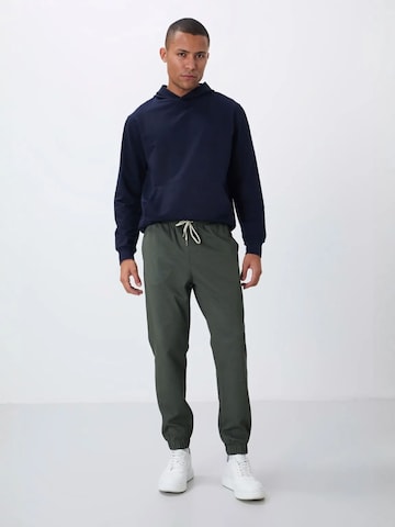Tapered Pantaloni di Tommy Life in verde