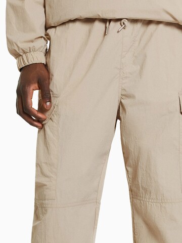 Bershka Tapered Hose in Beige