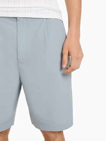 Bershka Loose fit Pleat-Front Pants in Blue