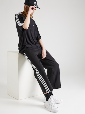 ADIDAS SPORTSWEAR Loose fit Workout Pants 'Future Icons' in Black