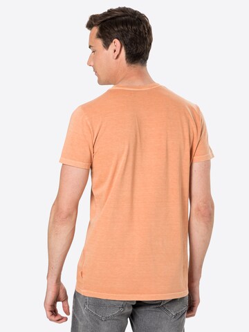 T-Shirt Revolution en orange