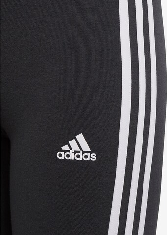 ADIDAS SPORTSWEAR Skinny Urheiluhousut 'Essentials 3-Stripes' värissä musta