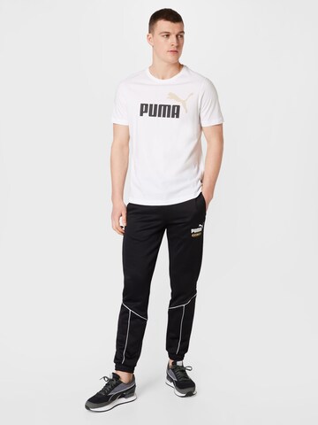 Effilé Pantalon de sport 'King' PUMA en noir