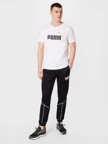 PUMA Zúžený Sportovní kalhoty 'King' – černá