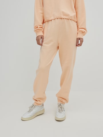 EDITED Loosefit Housut 'Riley' värissä oranssi