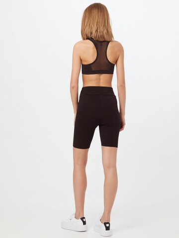 PUMA - Skinny Leggings em preto