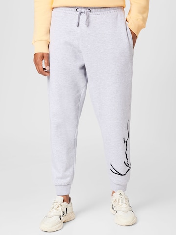 Karl Kani Tapered Pants in Grey: front