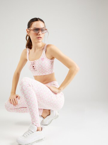 GUESS Skinny Sportbroek 'LOGOMANIA' in Roze